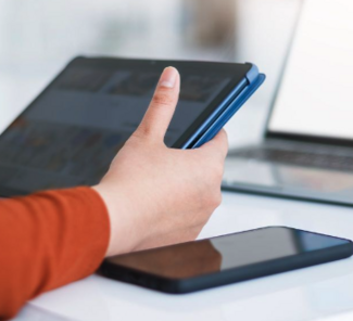 Researcher holding a tablet and consulting the screen