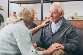 man with dementia speaks with nurse