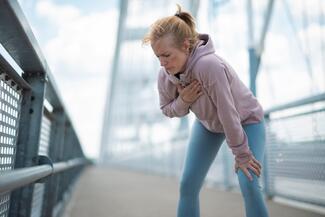 woman struggling to breathe after exercise