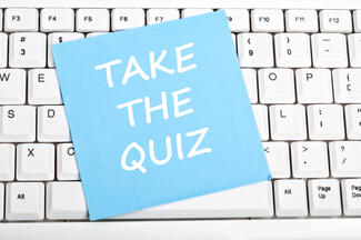 sticky note that reads "take the quiz"