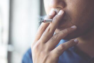 a man smokes a cigarette