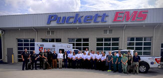Puckett EMS team with working dog for training