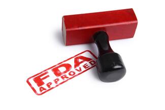 a rubber stamp says "FDA Approved"
