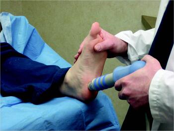 Dr. Koji Kawamata shares that visits to non-podiatric practitioners in Japan for heel pain may include X-rays, poultices or non-steroidal anti-inflammatory drugs. Some use shockwave therapy (as seen above), taping or publicly available insoles. Photo courtesy of Lowell Weil Jr., DPM