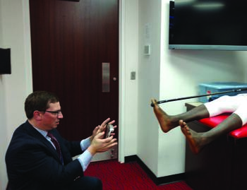 In this photo, Howard Osterman, DPM digitally scans a professional athlete for orthotics. To enhance communication with other care team members, he stresses that it is important to be up-to-date on technologies and treatment protocols. Photo courtesy of Howard Osterman, DPM.